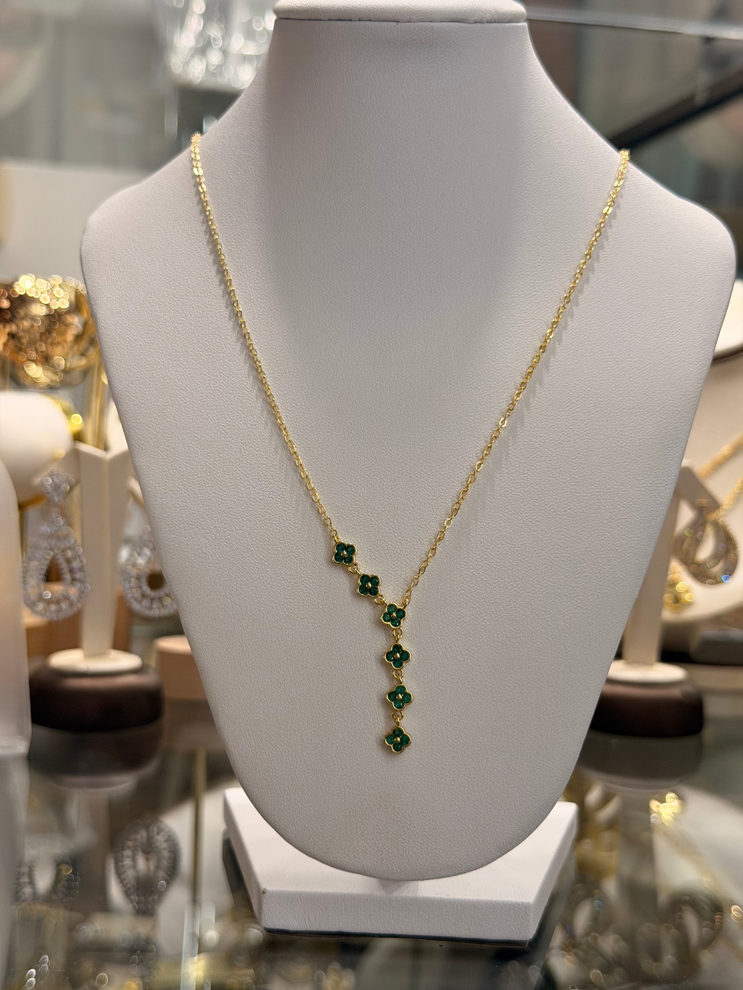 Set de flor con Cz green y blancos rodinado Gold